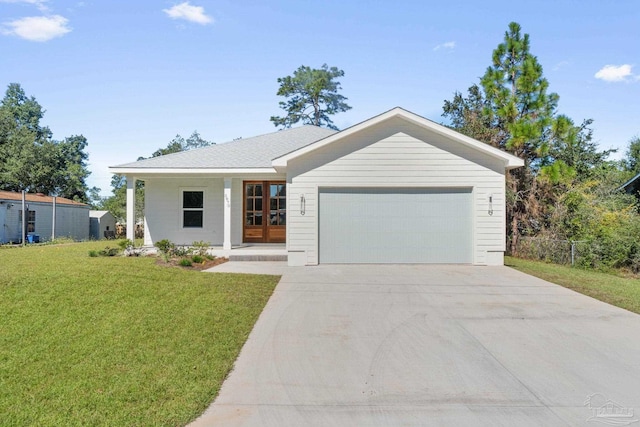 view of front of home with a front lawn and a garage