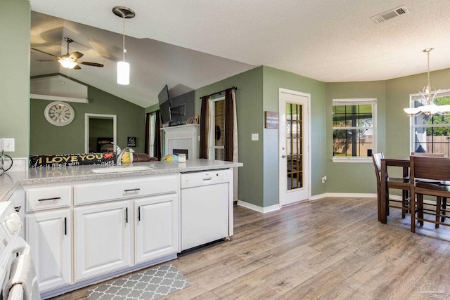 kitchen featuring sink, white dishwasher, light hardwood / wood-style floors, decorative light fixtures, and white cabinets