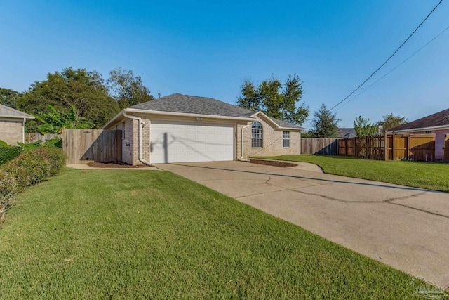 ranch-style home with a garage and a front lawn