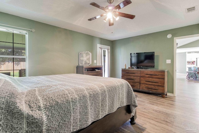 bedroom with light wood-type flooring and ceiling fan