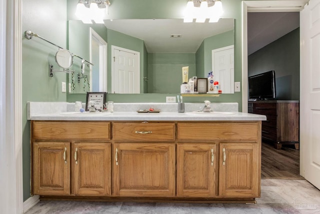 bathroom with vanity and hardwood / wood-style floors