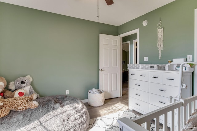 bedroom with ceiling fan and wood-type flooring