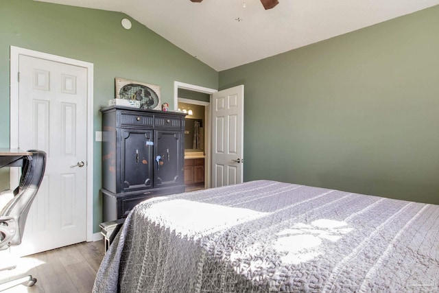 bedroom featuring ceiling fan, hardwood / wood-style flooring, and lofted ceiling