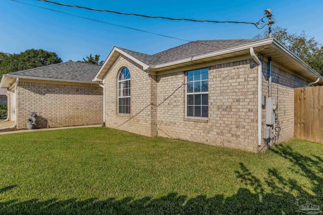 view of property exterior featuring a yard