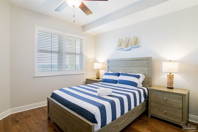 bedroom with a ceiling fan, baseboards, and wood finished floors