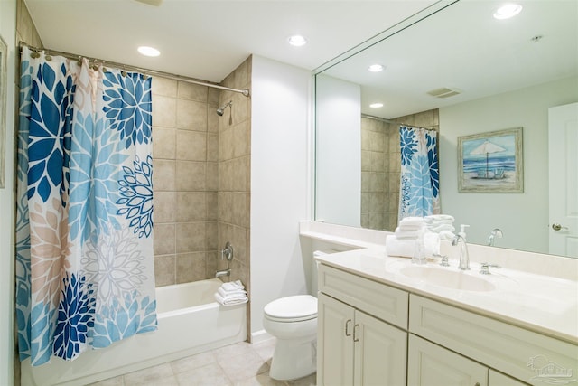 bathroom featuring visible vents, toilet, shower / bath combo with shower curtain, vanity, and tile patterned flooring