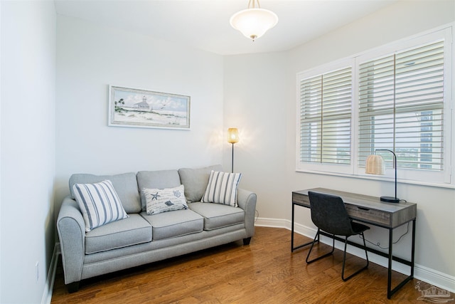 home office with wood finished floors and baseboards