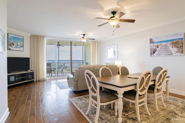 dining room with a ceiling fan, baseboards, ornamental molding, expansive windows, and dark wood finished floors