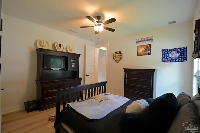 bedroom with light wood-type flooring and ceiling fan