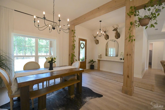 dining room featuring a notable chandelier and light hardwood / wood-style floors