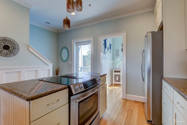 kitchen featuring pendant lighting, white cabinetry, light hardwood / wood-style flooring, stainless steel appliances, and ornamental molding