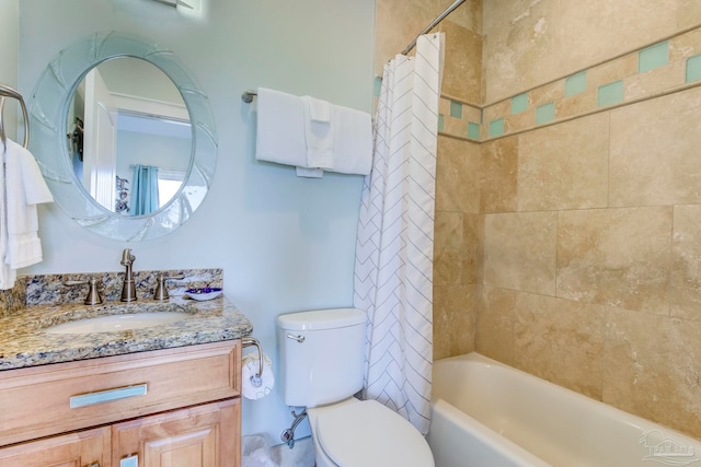 full bathroom with vanity, toilet, and shower / tub combo with curtain