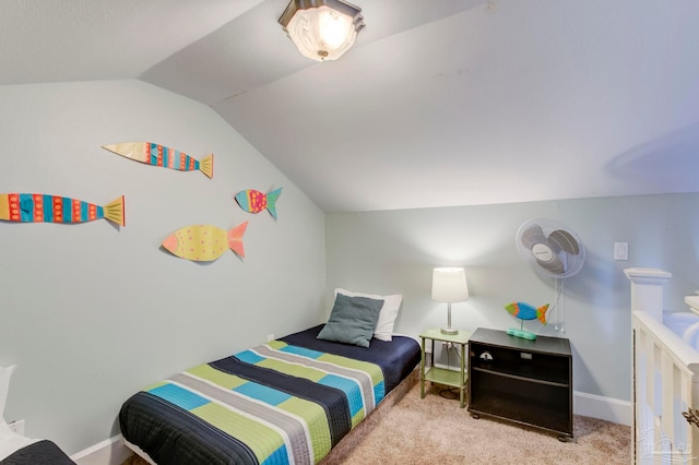 bedroom with lofted ceiling and light colored carpet