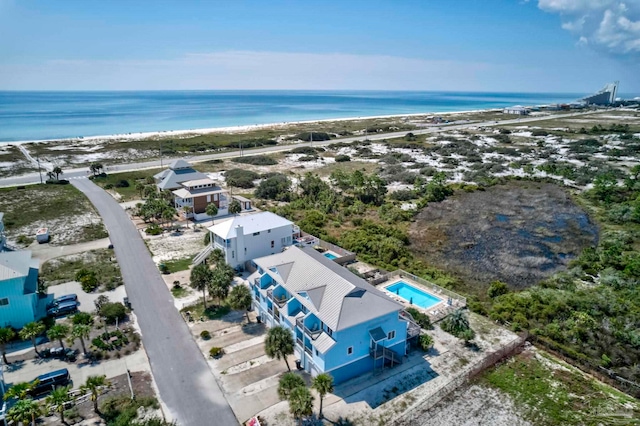 drone / aerial view featuring a view of the beach and a water view