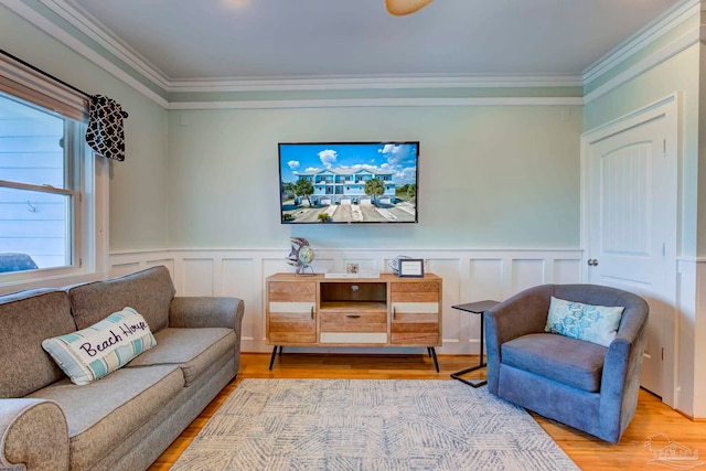 interior space featuring ornamental molding and light hardwood / wood-style floors