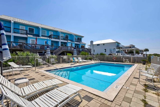 view of swimming pool featuring a patio area