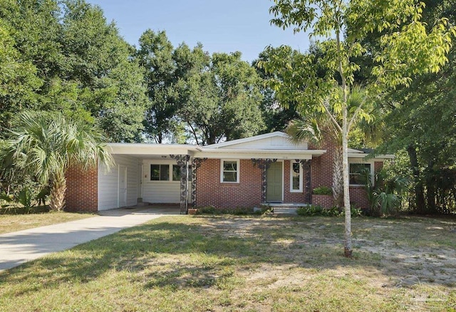 single story home featuring a carport and a front lawn