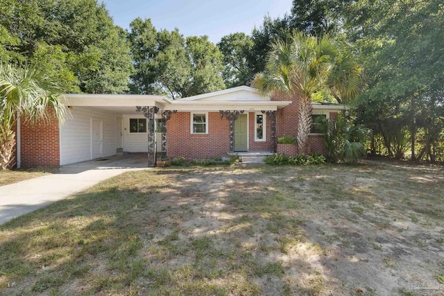 ranch-style house with a carport and a front yard