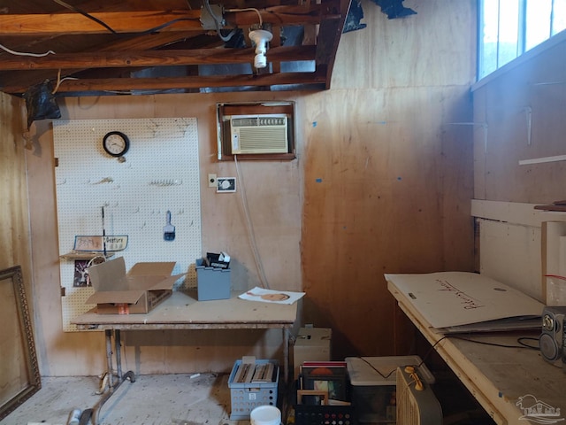 office space with a workshop area and a wall mounted AC