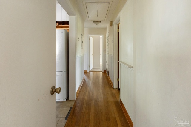 corridor featuring light hardwood / wood-style floors