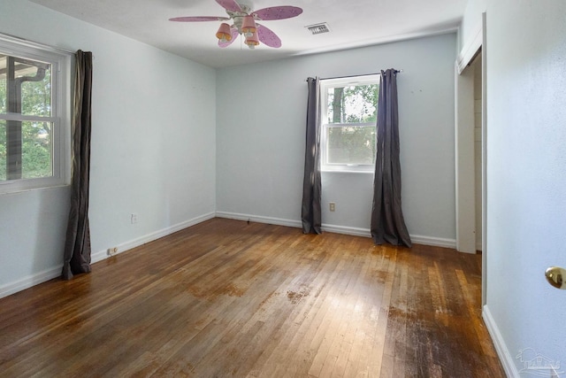 spare room with hardwood / wood-style floors and ceiling fan