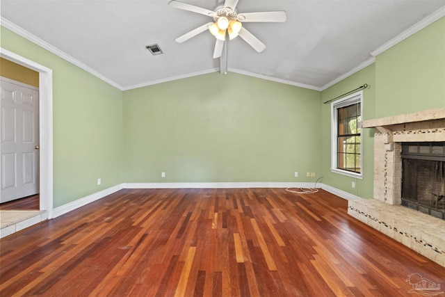 unfurnished living room featuring hardwood / wood-style flooring, vaulted ceiling with beams, a fireplace, and crown molding