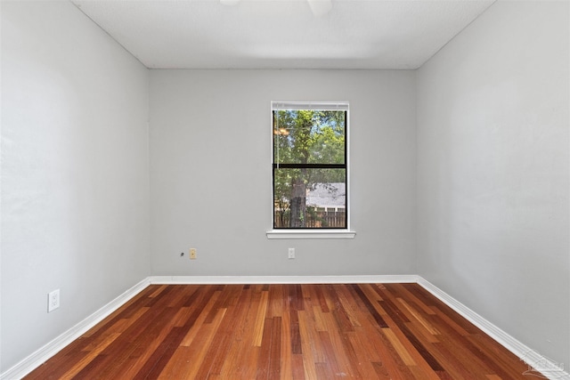 unfurnished room featuring hardwood / wood-style flooring