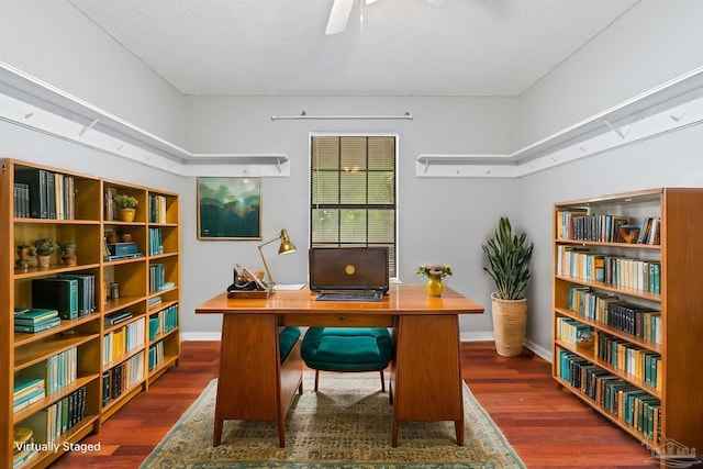 office featuring dark wood-type flooring and a textured ceiling