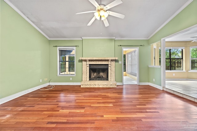 unfurnished living room featuring ceiling fan, light hardwood / wood-style floors, and a healthy amount of sunlight