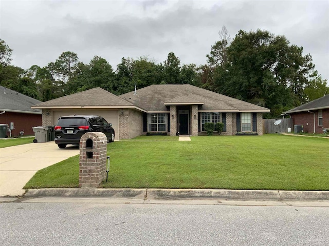 ranch-style home with a garage and a front yard