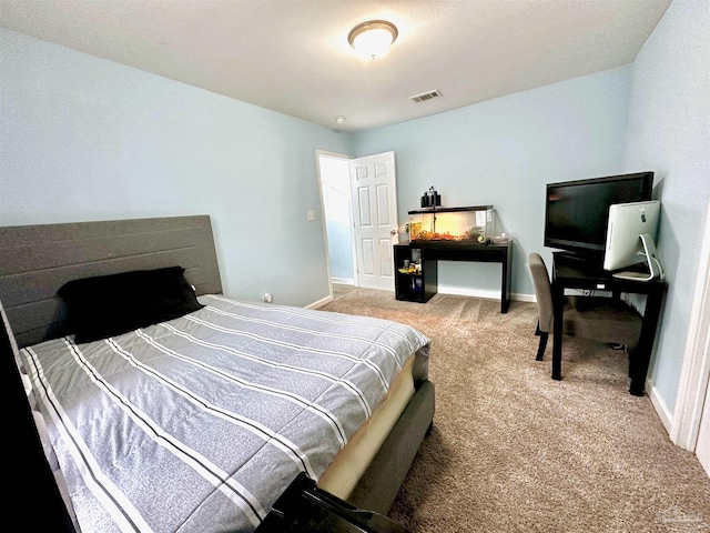 bedroom featuring light colored carpet