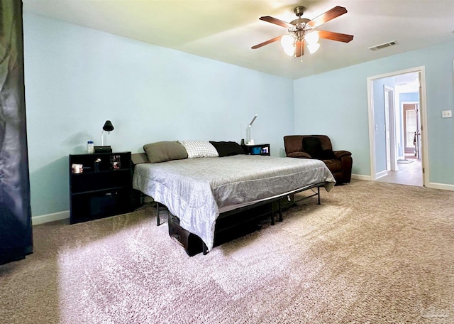 bedroom featuring ceiling fan and carpet