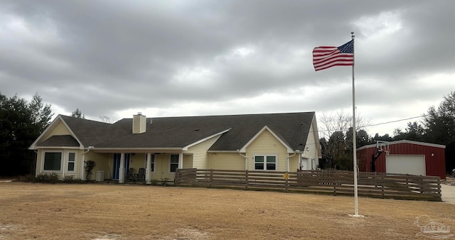 view of front of home with an outbuilding and a garage