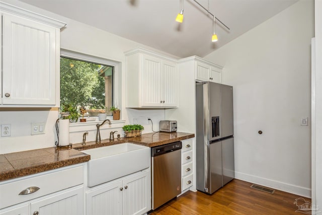 kitchen with stainless steel appliances, dark wood-type flooring, sink, and white cabinetry