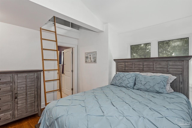 bedroom featuring wood-type flooring and lofted ceiling