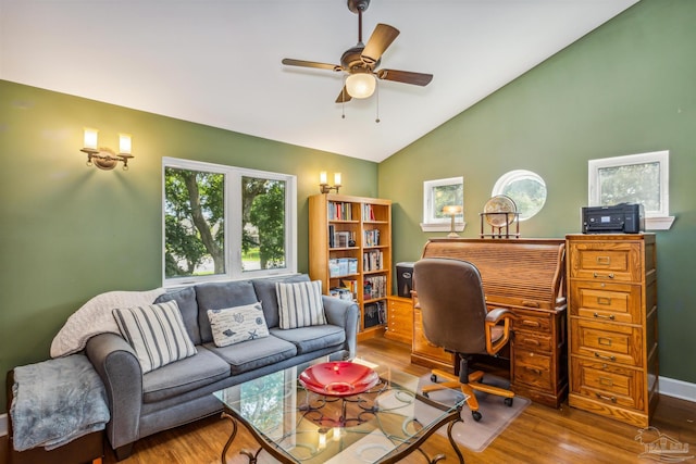 office with vaulted ceiling, ceiling fan, and hardwood / wood-style flooring