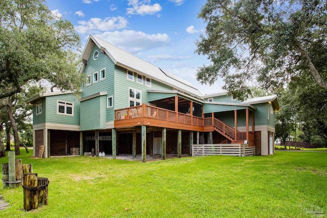 back of house with a deck and a yard