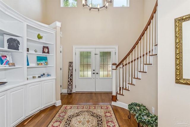 foyer entrance featuring french doors, dark hardwood / wood-style floors, and plenty of natural light