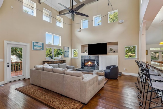 living room with a towering ceiling and a wealth of natural light