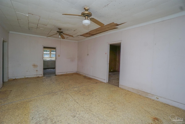 spare room featuring crown molding and ceiling fan