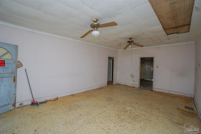 unfurnished room with ceiling fan, crown molding, and speckled floor