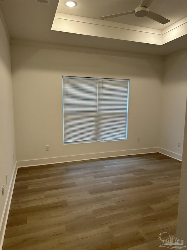 empty room with recessed lighting, baseboards, a ceiling fan, and wood finished floors