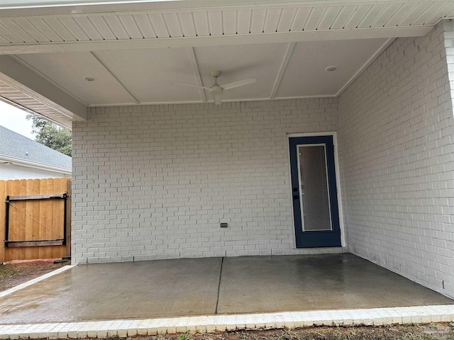 view of patio / terrace featuring fence and a ceiling fan