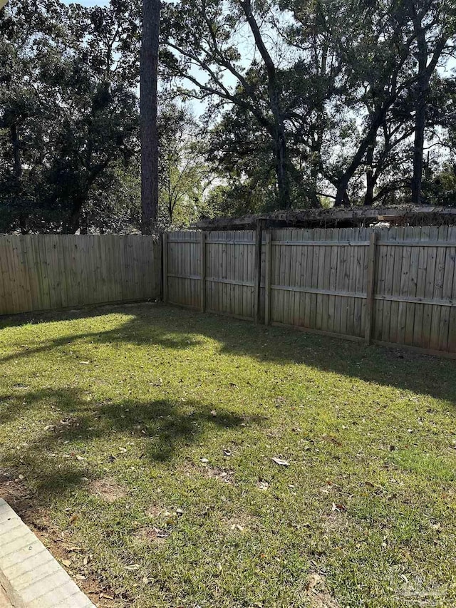 view of yard with a fenced backyard