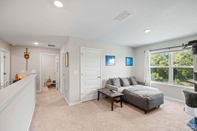 carpeted bedroom with a textured ceiling