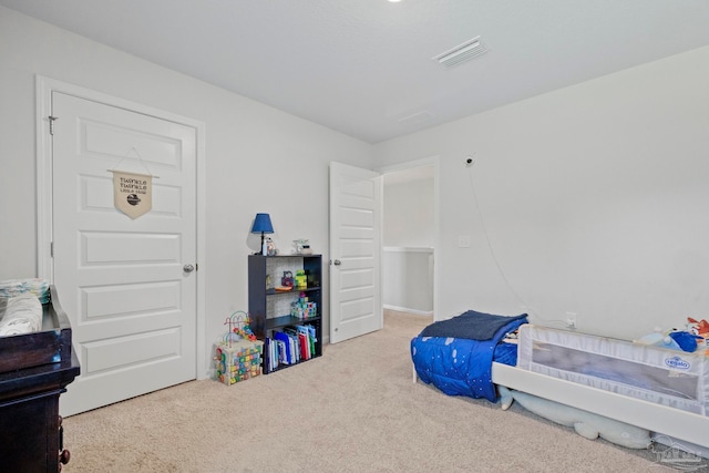 bedroom featuring carpet