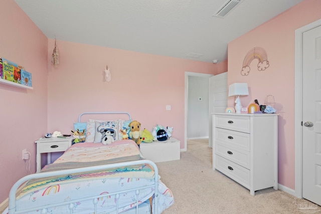 bedroom with light carpet