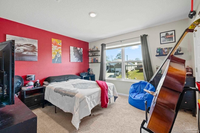 carpeted bedroom with a textured ceiling