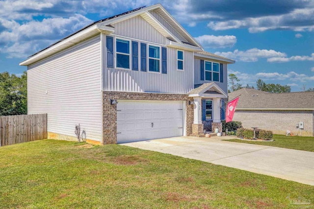 view of front of house with a garage and a front lawn