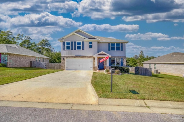 view of front of home with a front lawn and a garage